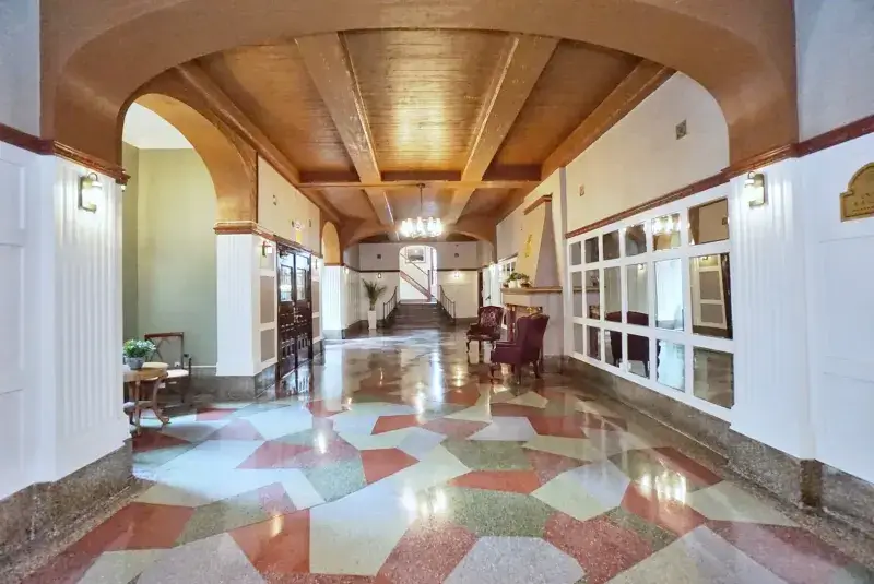 Historic preservation project featuring terrazzo flooring, arched design details, and restored architectural elegance in Staten Island.