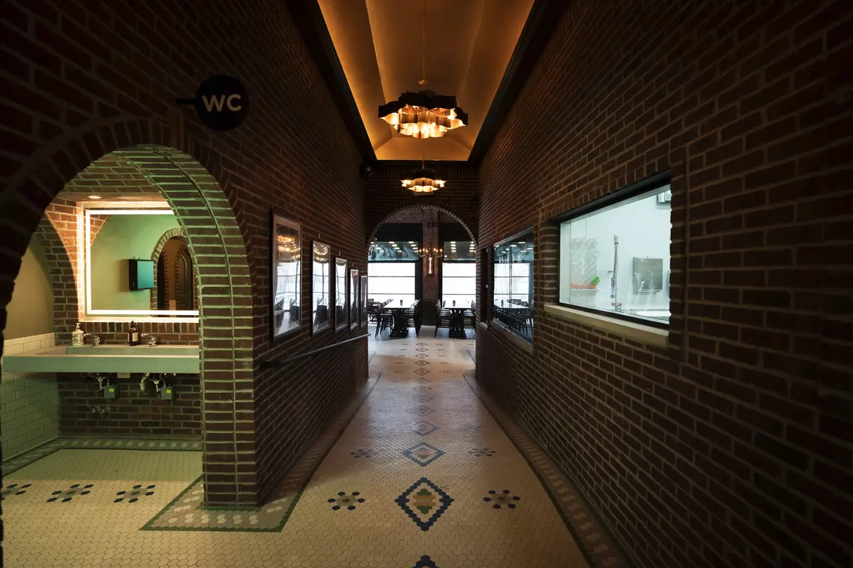 Brewery entrance with industrial brick architecture, modern taproom aesthetics, and a welcoming craft beer ambiance.