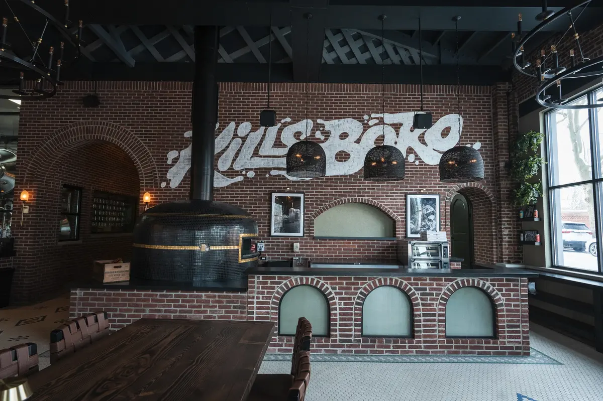 Modern dining space with brick design, industrial style, and a bold urban aesthetic.