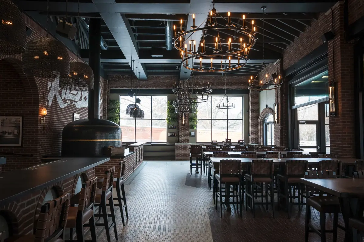 Inviting brewery entrance with warm lighting, rustic decor, and a welcoming ambiance.