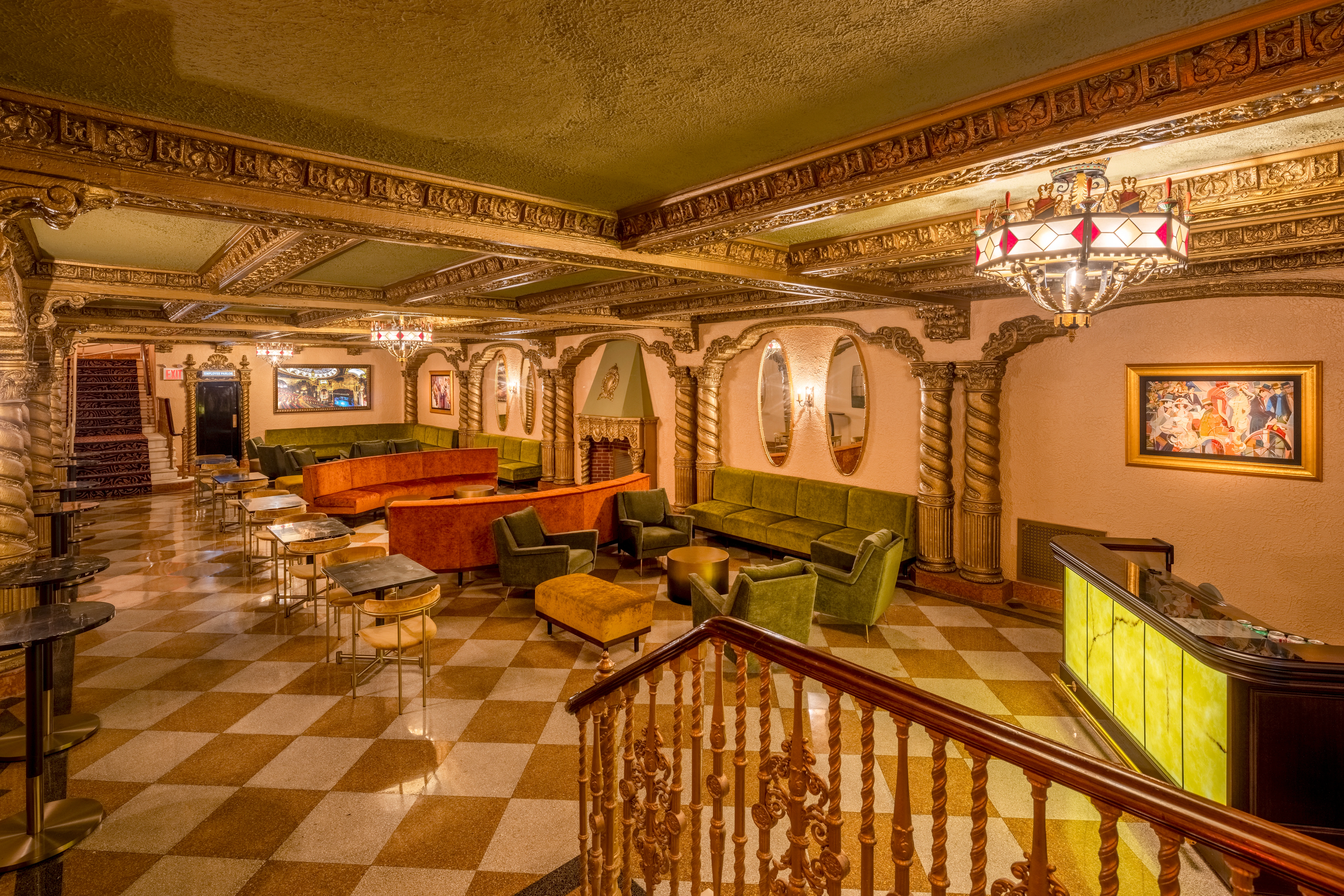 VG Lounge at Saint George Theatre with ornate gold ceilings, sculpted columns, and vintage lighting.