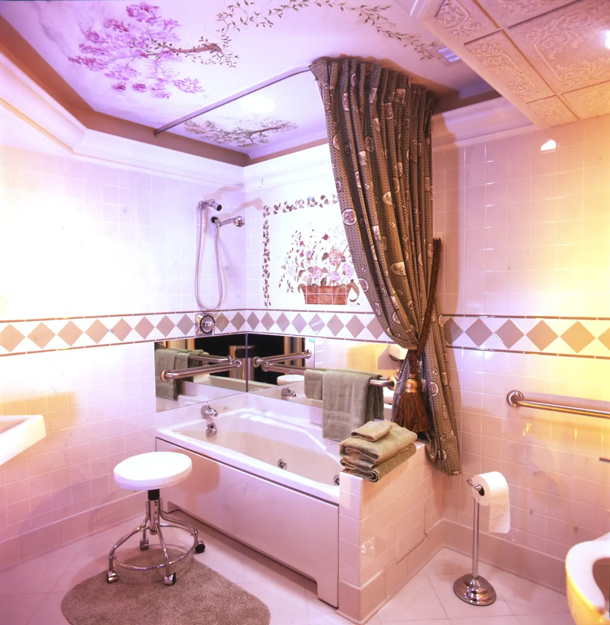 Luxury maternity bath with an immersion tub, spa-like ambiance, floral tile design, and a relaxing atmosphere.
